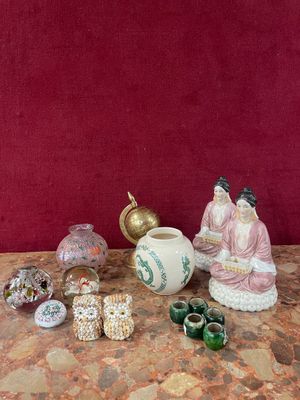 a lot of small figurines sitting on a table