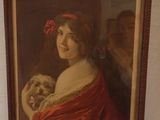 a painting of a woman holding a dog on a wall
