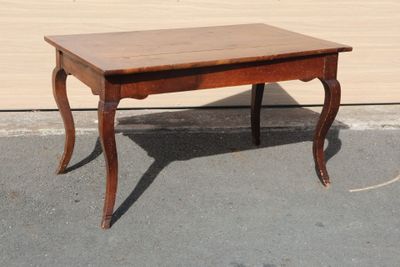 a small table that is sitting on the pavement