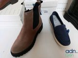 two pairs of shoes that are sitting on a table