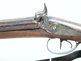 an old gun that is sitting on top of a table