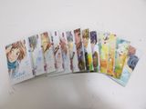 a bunch of anime cards sitting on top of a table