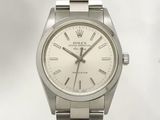 an image of a rolex watch with a white dial and roman numerals