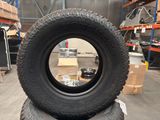 tires are stacked on top of each other in a warehouse