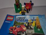 a lego city book on a table next to a lego motorcycle
