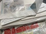 a pile of mail sitting on top of a table