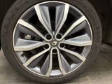a close up view of a car ' s wheel and tire