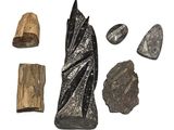 a close up of a group of rocks and stones on a white surface