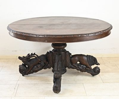 a wooden table with a horse on it on a tile floor