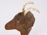 a sculpture of a goat with horns on it ' s head