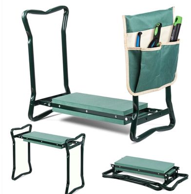 a green garden bench with two benches and a bag