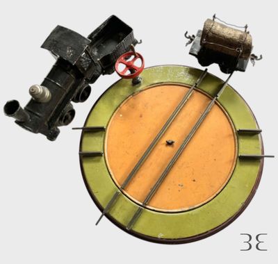 une horloge sur laquelle figure un train et un autre train