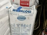 a pile of white bags sitting on top of a pile of white bags