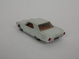 a toy car that is sitting on a white surface