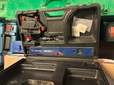 a tool box with tools in it sitting on a table