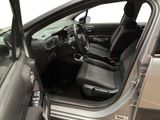 the interior of a car with the door open and the driver ' s seat down