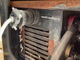a close up of a machine with a hose attached to it