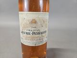 a bottle of wine that is sitting on a table