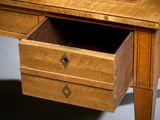 a wooden desk with a drawer on top of it