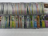 a large collection of pokemon trading cards are displayed on a table