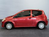 a picture of a small red car parked in a garage