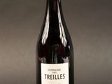 a bottle of wine that is sitting on a table
