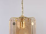 a close up of a light fixture hanging from a ceiling