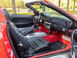 the interior of a red sports car with its doors open