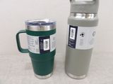 a cup and a thermos sitting next to each other