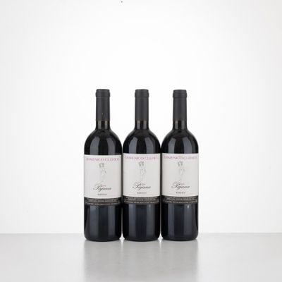 three bottles of wine sitting on top of a table next to each other