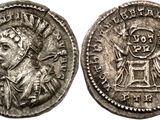 a silver coin with an image of a man on it