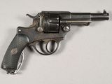 gun on a white surface