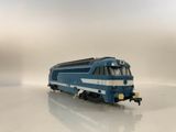 a toy train that is sitting on a white surface