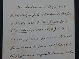 une vieille lettre écrite à la main sur un morceau de papier avec une écriture dessus
