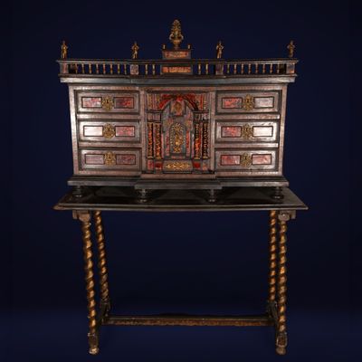 an antique desk with a wooden top and ornate carvings on the top