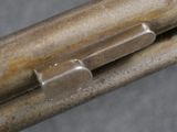 an image of a close up of a gun on a table