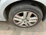 a close up of a car ' s tire on the ground