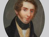 portrait of a man in a black coat and a white shirt
