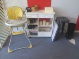 a baby highchair in the corner of a room