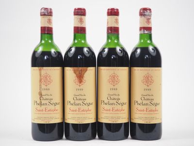 trois bouteilles de vin sont alignées sur une surface blanche