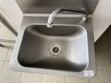 a stainless steel sink with a faucet in it