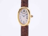 a close up of a wrist watch with a brown strap