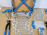 a box of tools sitting on top of a cardboard box