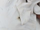 a close up of a statue of a person in a white dress