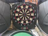 a dart that is in the middle of a dart board