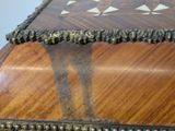 a wooden box that has a decorative design on it