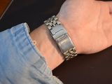 a person that is wearing a bracelet on their wrist