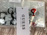 a pair of scissors and a pair of scissors on a bed