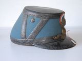 a blue hat with a monkey sitting on top of it