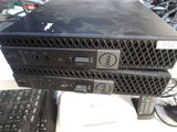 two computers sitting on top of each other on a table